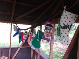 Christmas stockings hung in a forest hut