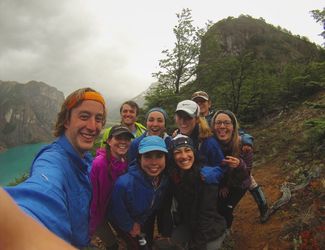 Patagonia trip group smiling in the rain