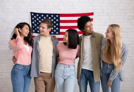 Group of friends in front of an American flag